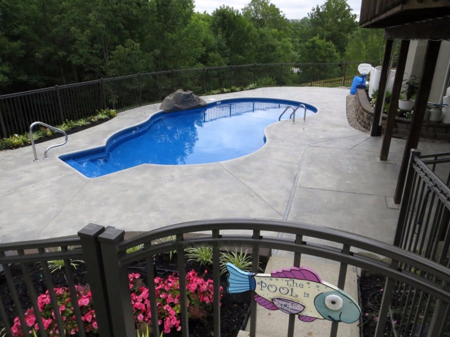 A resort pool deck with a decorative concrete flooring